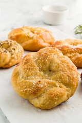 Warm, freshly baked pretzels with golden crust and savory toppings