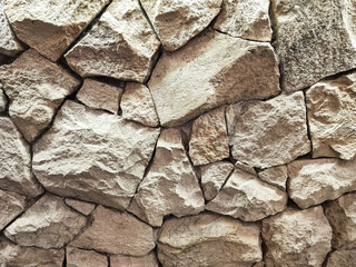 Background of natural stone wall texture. Abstract wall texture of limestone for decoration and construction needs.