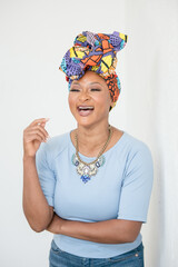 Nigerian Woman with headwrap laughing