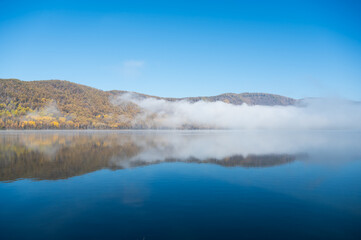 Early morning views of the lake and the mist on the surface of the water