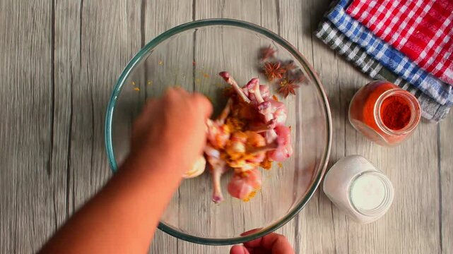 Chicken lollipop making. Marinating the chicken leg piece with ginger garlic paste turmeric chilly,etc.