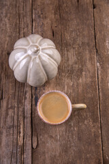 Small cup of espresso on a wooden table