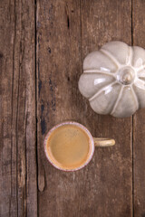 Small cup of espresso on a wooden table