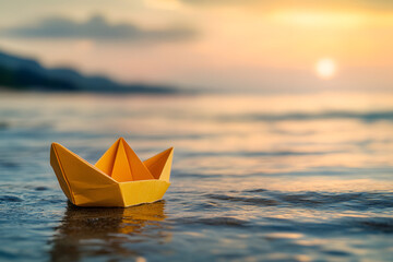 Yellow paper boat floating on calm water during sunset, symbolizing childhood memories, tranquility, and dreams in a peaceful, scenic beach setting with soft warm light
