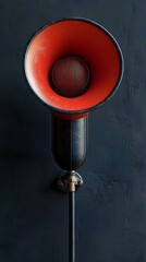 Fototapeta premium Bright Red Vintage Style Audio Speaker with Grille in Dark Room