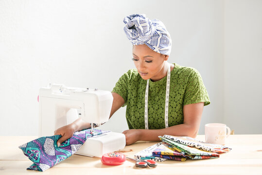 Woman Concentrating on sowing fabric