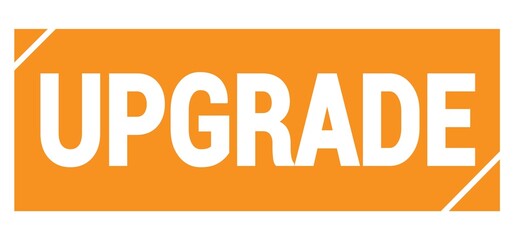 UPGRADE text written on orange stamp sign.
