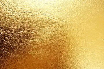 Fototapeta premium Metallic golden and bronze paper texture with gradient effect, resembling metal foil or wall paint, Golden background. Gold texture. Beautiful luxury gold background. Shiny golden texture