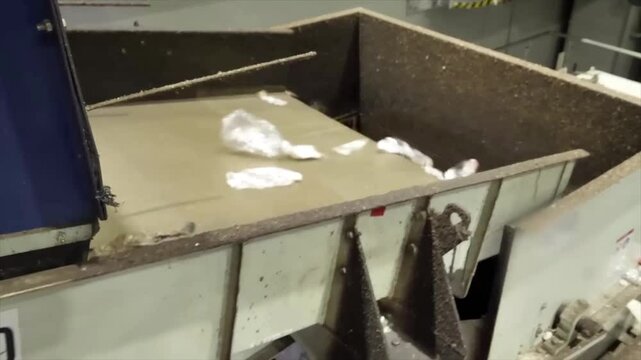 Conveyor with plastics and PET bottles. Plastic bottles destined for recycling - disposal and recovery of plastic waste due to environmental pollution.