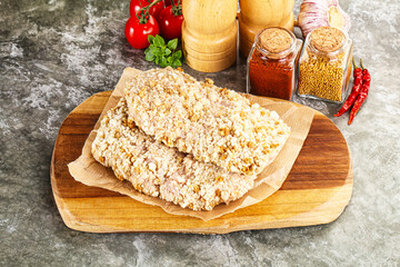 Breaded raw breaded meat schnitzel