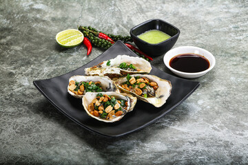 Open half oysters with green onion