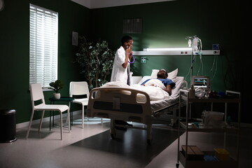 Dedicated doctor attentively uses her stethoscope to examine and assess the patient's heart, ensuring thorough care and attention to their well-being.