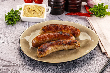 Delicous natural roasted sausages in the plate