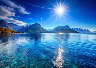 Obraz premium Tranquil Blue Sea with Majestic Mountains and Sunlit Waves - Nature Photography