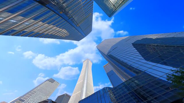 Looking up at the high-rise buildings in the city, the development of Chinese cities，High rise urban buildings, modern high-end office buildings, and commercial office buildings in Beijing, China