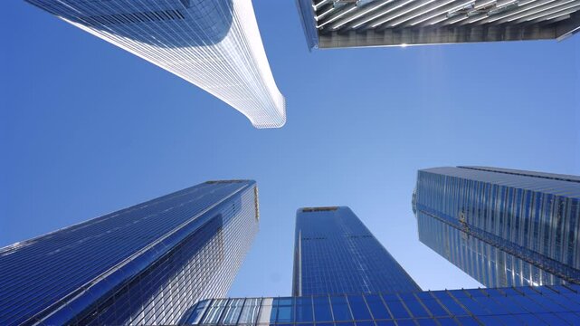 Looking up at the high-rise buildings in the city, the development of Chinese cities，High rise urban buildings, modern high-end office buildings, and commercial office buildings in Beijing, China