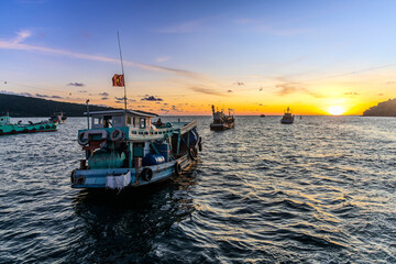 Sunset in the floating fishing village. An Thoi Port, Tropical Phu Quoc Island, Vietnam © sergeymugashev