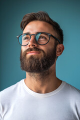 Obraz premium Proud man with glasses looking upward with approving, happy, expression of content.