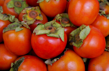 Persimmon fruits background	