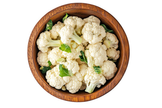 Pile of Cauliflower in a wooden bowl from above view isolated on background, fresh vegetables for refreshing taste and health benefits.