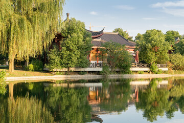 Obraz premium red old building in china with pagodas on the lake shore