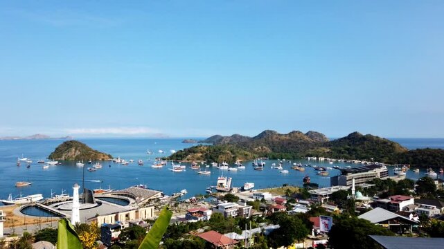 Harbour of Labuan Bajo, Ost Nusa Tenggara, Flores, Indonesia, Southeast Asia.
Island Monyet on the left, Islands Bajo, Kelapa and Seture on the right, Komodo National Park in the background.