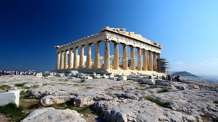 Naklejka premium The ancient Parthenon standing proudly atop the Acropolis in Athens under a bright clear blue sky.