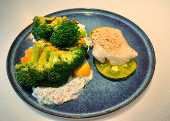 Fish with broccoli and carrots. Proper nutrition.