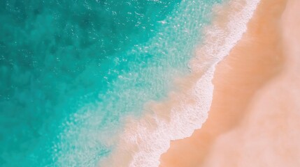 Waves crash softly on golden sand, creating a serene atmosphere at a pristine beach under clear blue skies