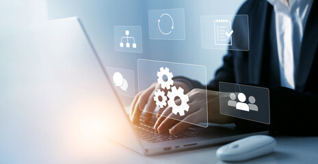 Develop efficiency of business process with automation and improve technology optimization.Businessman who works at laptop for technology development.