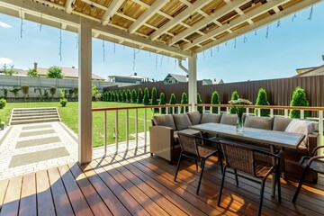 Serene Outdoor Patio with Comfortable Seating and Greenery