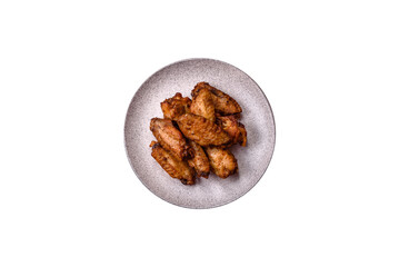 Grilled chicken wings with salt, spices and herbs