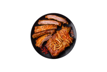 Pork or beef ribs with salt, spices and herbs baked on the grill