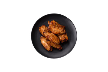 Grilled chicken wings with salt, spices and herbs