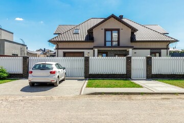 Modern Suburban Home with Car Parked in the Driveway
