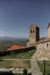 Fototapeta premium A Historic Church That Is Beautifully Surrounded by Lush Nature and Scenic Landscapes
