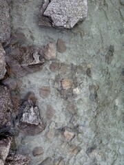 stone wall background, Crystal-clear, azure waters of Morskie Oko, revealing beautiful stone bottoms. Perfect for showcasing nature's beauty and tranquil landscapes.