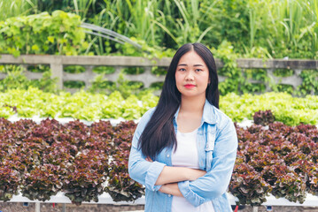 Portrait Salad farm young women owner happy smiling face look at camera. Salad farm vegetable green oak red oak lettuce organic hydroponic vegetable plantation gardener green salad cultivate farmer