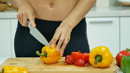 Close up Women hand prepare fruit vegetables vegan salad season oil salad dressing green oak red oak lettuce at home kitchen. Women hands cooking vegan healthy fresh fruit tomato pepper vegetables