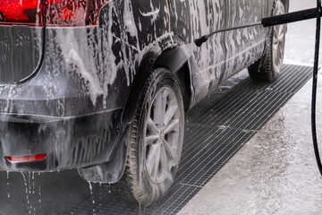 SUV Being Washed at Car Wash