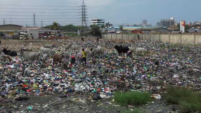 Ghana, Accra,   AGBOGBLOSHIE the largest landfill illegal dump in Africa for electronic and plastic waste from the Western world. High environmental toxic pollution area , climate change warming 