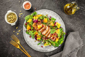 Duck salad with grilled breast and vegetables on plate, Thanksgiving dinner top view