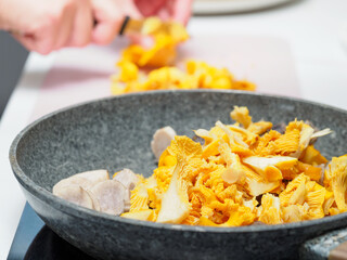 Making of golden chanterelle (Cantharellus cibarius) mushrooms souce