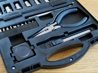 Fototapeta premium Black case with separated slots in shape of variety repairing hand tools