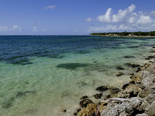 Sainte Anne coastline close to city center in Guadeloupe with scenic turquoise sea and rocks...