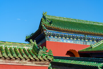 Architectural details of gates and palaces in the Temple of Heaven under blue sky in Beijing, China