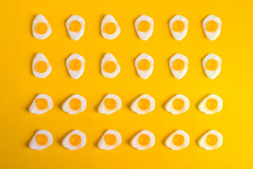 Egg jelly candy isolated on the yellow background