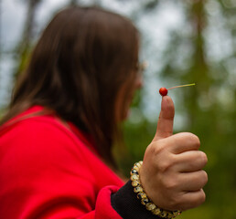 Girl shows gesture - Like Apple (thumbs up)