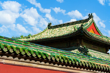 Decoration details of gates and palaces in the Temple of Heaven under blue sky,  a major landmark and travel destination in Beijing, China