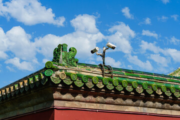 CCTV camera on the roof  in the Temple of Heaven under blue sky,  a major landmark and travel destination in Beijing, China